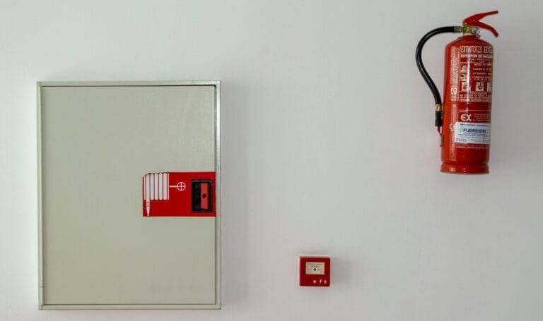 Security FAQ 1 fire extinguisher on wall scaled e1714699619763